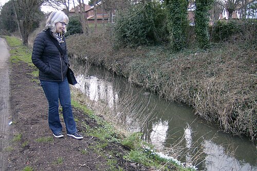 Pauline inspects the Ouseburn at Mortuary Lane