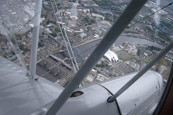 Aerial view of Newcastle's bridges taken from vintage aircraft 