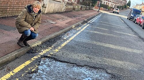 Jude by a huge pothole on Simonside
