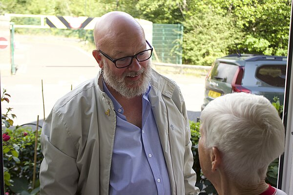 Stephen Kelly talking to a ward resident on the doorstep