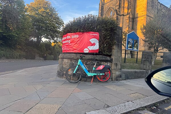 Dott bike outside church in Newcastle