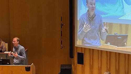 Mark at the lectern in the Council chamber