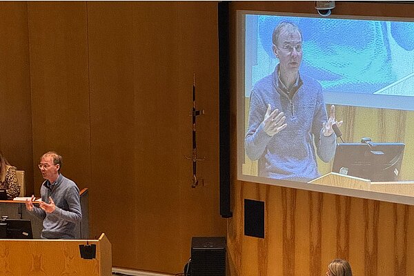 Mark at the lectern in the Council chamber