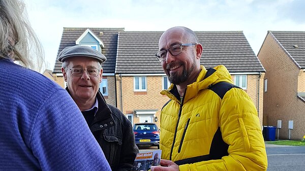 PJ and Mark talk to voter