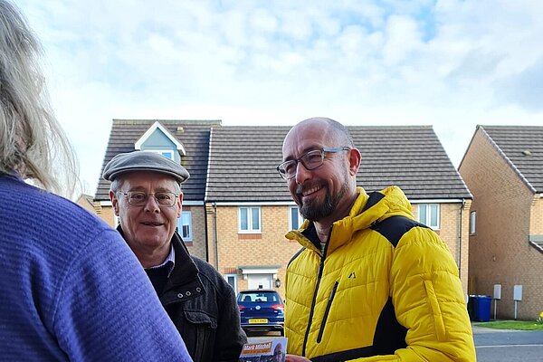 Mark Mitchell & PJ talk to a resident