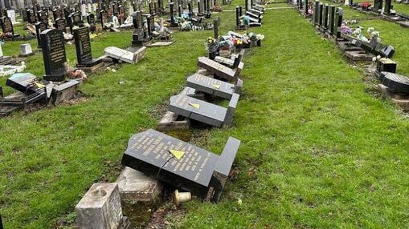 Gravestones laid on grass